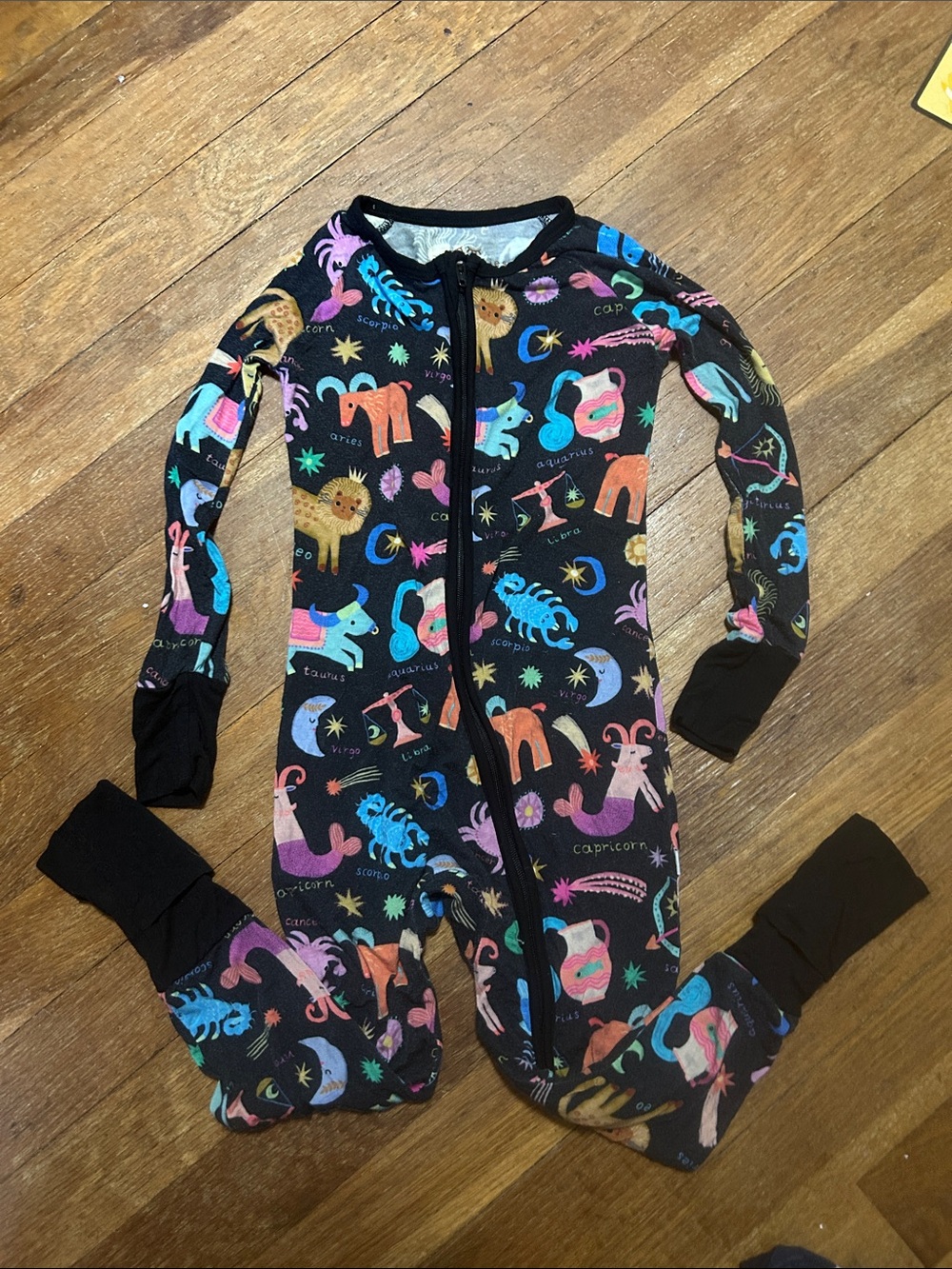Little Sleepies Black One-Piece Pajamas with Colorful Zodiac Animal Print